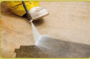 Pressure washing a stained path